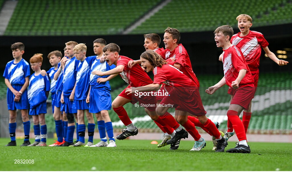 29 May 2024; Beaumont BNS, Blackrock, Cork, players celebrate winning the C Cup, for mixed large sized schools, following a penalty shoot-out victory over St Declan’s NS, Ashbourne, Meath, in a play-off match during the FAI Primary 5s Finals day at Aviva Stadium in Dublin. Photo by Stephen McCarthy/Sportsfile