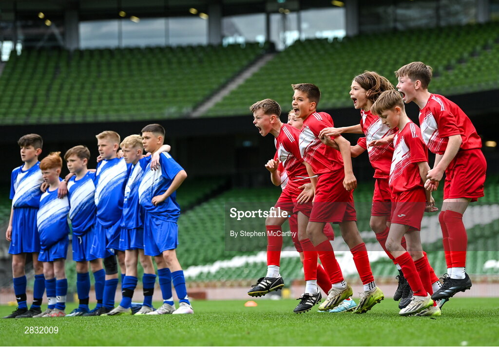 29 May 2024; Beaumont BNS, Blackrock, Cork, players celebrate winning the C Cup, for mixed large sized schools, following a penalty shoot-out victory over St Declan’s NS, Ashbourne, Meath, in a play-off match during the FAI Primary 5s Finals day at Aviva Stadium in Dublin. Photo by Stephen McCarthy/Sportsfile