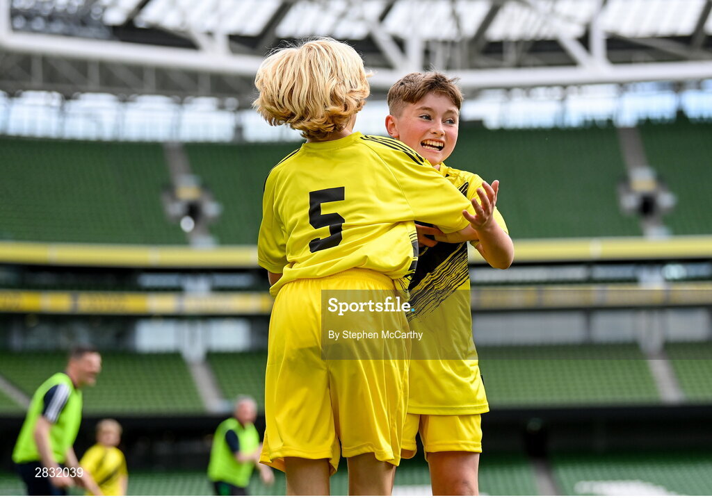 29 May 2024; Conor Farrell, right, and Lewis Quinn of St Eunan’s NS, Raphoe, Donegal, celebrate scoring a goal in the B Cup, for mixed medium sized schools, during the FAI Primary 5s Finals day at Aviva Stadium in Dublin. Photo by Stephen McCarthy/Sportsfile