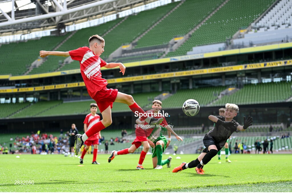 29 May 2024; Tom Ó Caoimh of Gaelscoil Choinn tSáile, Cork, scores a goal in their B Cup, for mixed medium sized schools, match against Scoil Phádraig, Westport, Mayo, during the FAI Primary 5s Finals day at Aviva Stadium in Dublin. Photo by Stephen McCarthy/Sportsfile
