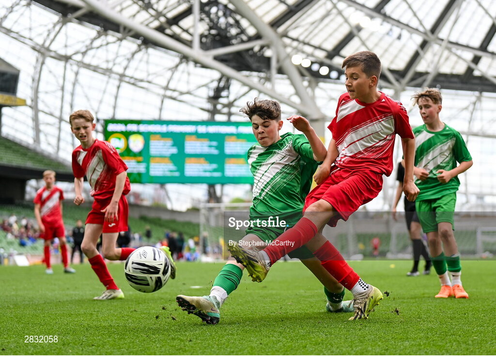 29 May 2024; Tadhg Quirke of Beaumont BNS, Blackrock, Cork, in action against Tadhg Murphy of St Joseph’s PS, Ballinrobe, Mayo, in their C Cup, for mixed large sized schools, match during the FAI Primary 5s Finals day at Aviva Stadium in Dublin. Photo by Stephen McCarthy/Sportsfile