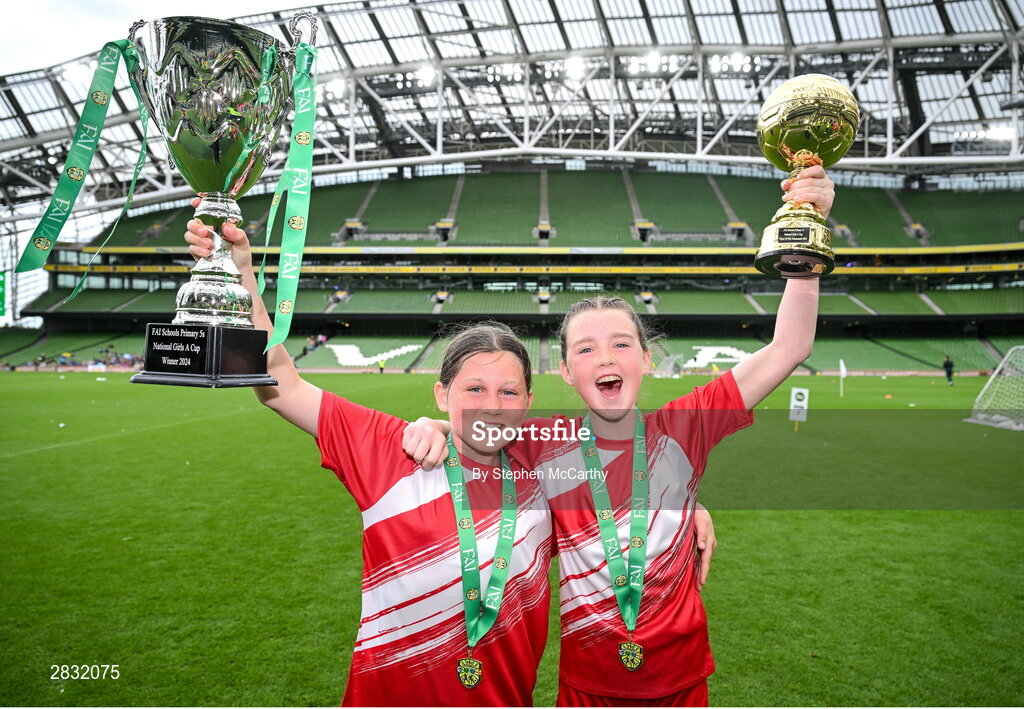 29 May 2024; Shauna Cullinane, left, and Roise Walsh of Gurrane NS, Cork, celebrate after winning the girls section A cup, for small sized schools, during the FAI Primary 5s Finals day at Aviva Stadium in Dublin. Photo by Stephen McCarthy/Sportsfile