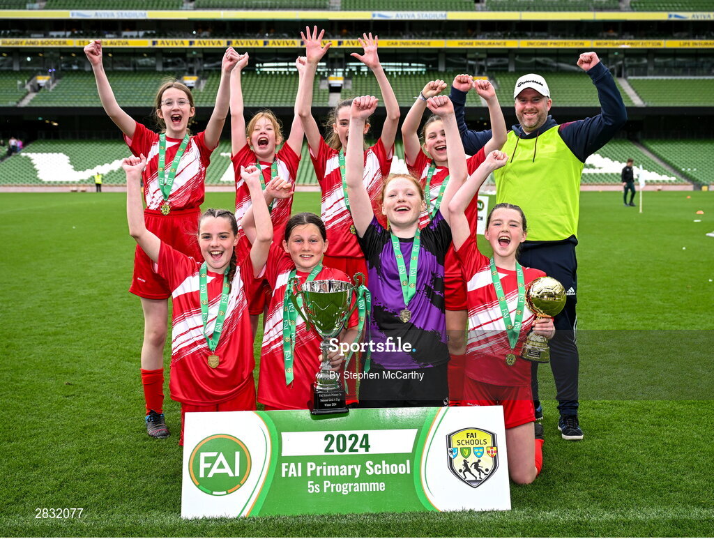 29 May 2024; Gurrane NS, Cork, celebrate after winning the girls section A cup, for small sized schools, during the FAI Primary 5s Finals day at Aviva Stadium in Dublin. Photo by Stephen McCarthy/Sportsfile