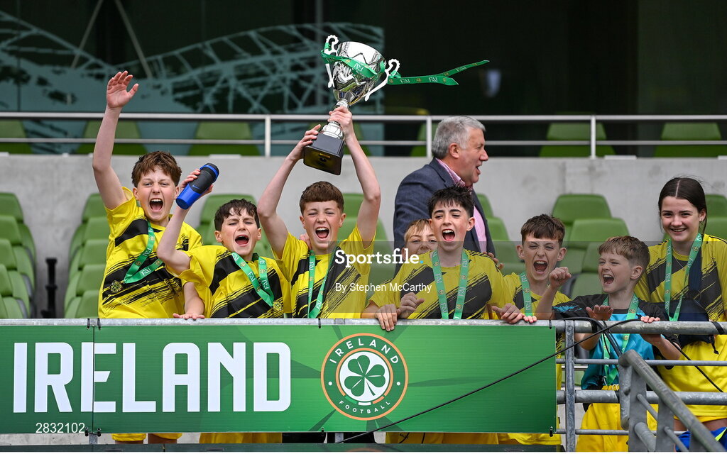 29 May 2024; Gaelscoil Cois Feabhail, Craigtown, Donegal, players celebrates after winning the section A cup, for mixed small sized schools, during the FAI Primary 5s Finals day at Aviva Stadium in Dublin. Photo by Stephen McCarthy/Sportsfile