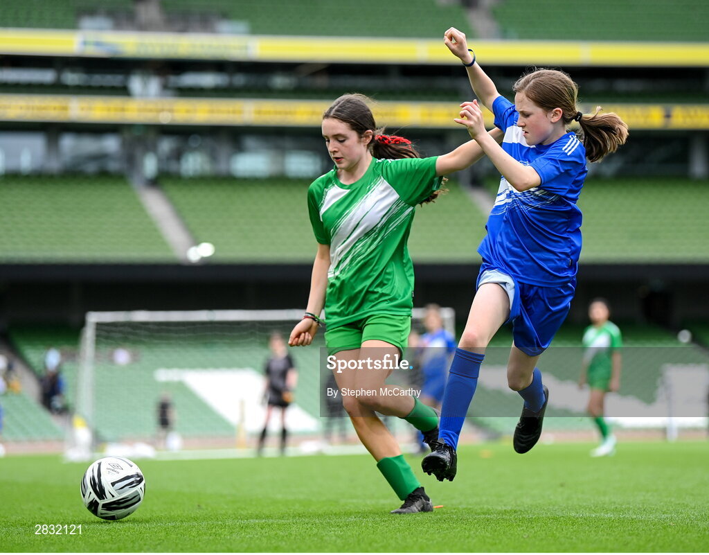 29 May 2024; Nicole Cummins of Tierneevin NS, Galway, left, in action against Keira Lyons of St Leonard’s NS, Dunnamaggin, Kilkenny, in their girls section A cup, for small sized schools, match during the FAI Primary 5s Finals day at Aviva Stadium in Dublin. Photo by Stephen McCarthy/Sportsfile