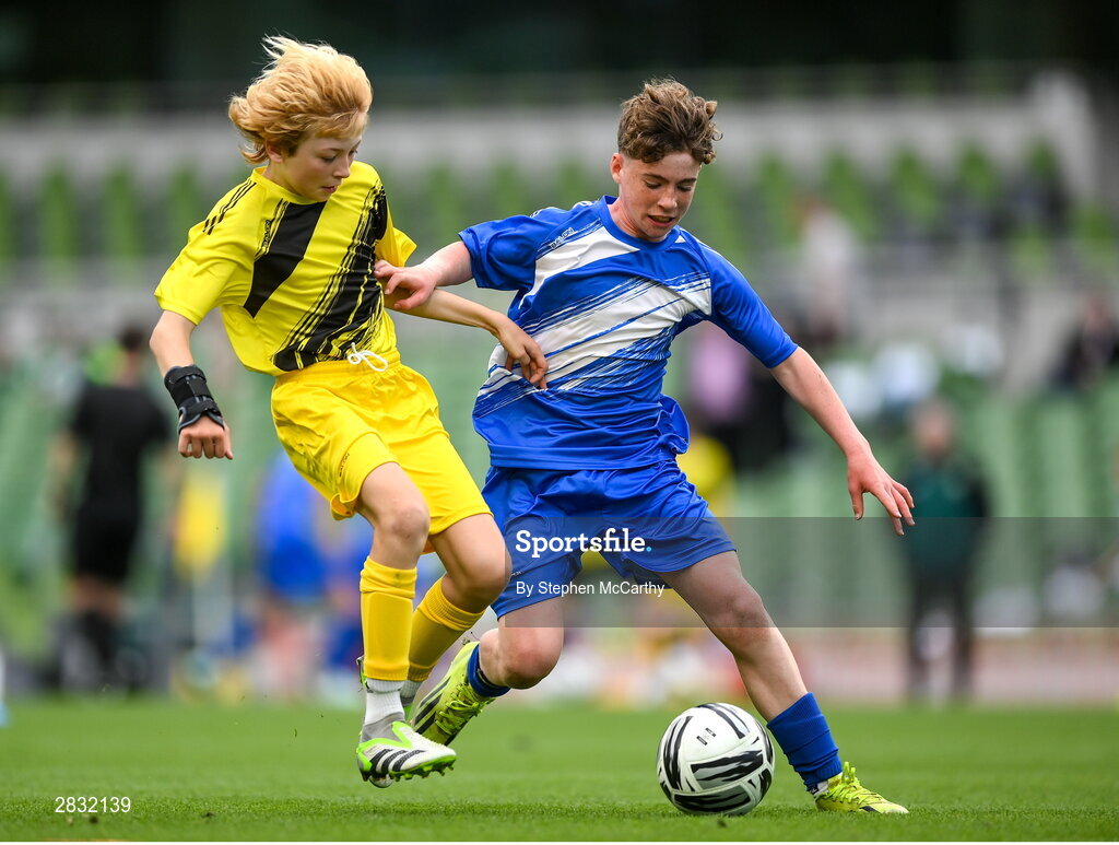 29 May 2024; Mossie Gillic of Kentstown NS, Meath, in action against Lewis Quinn of St Eunan’s NS, Raphoe, Donegal, in their section B cup, for mixed medium sized schools, match during the FAI Primary 5s Finals day at Aviva Stadium in Dublin. Photo by Stephen McCarthy/Sportsfile