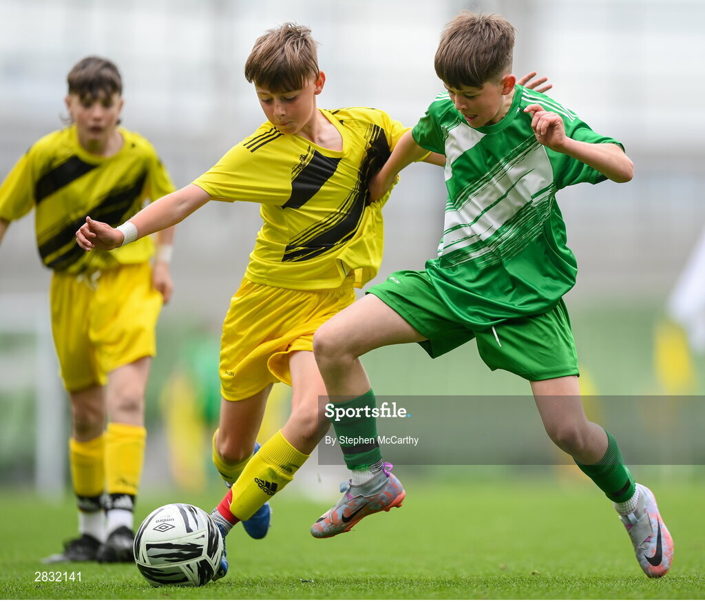 29 May 2024; Matthew Tierney of St Joseph’s PS, Ballinrobe, Mayo, in action against Ryan Gallagher of Illistrin NS, Donegal, in their section C cup, for mixed large sized schools, mathc during the FAI Primary 5s Finals day at Aviva Stadium in Dublin. Photo by Stephen McCarthy/Sportsfile