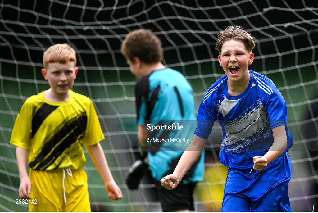 29 May 2024; Lennon O’Brien of Scoil Eoin, Crumlin, Dublin, celebrates after scoring against Scoil Íosagáin, Buncrana, Inishowen, Donegal, in their Football For All cup match during the FAI Primary 5s Finals day at Aviva Stadium in Dublin. Photo by Stephen McCarthy/Sportsfile
