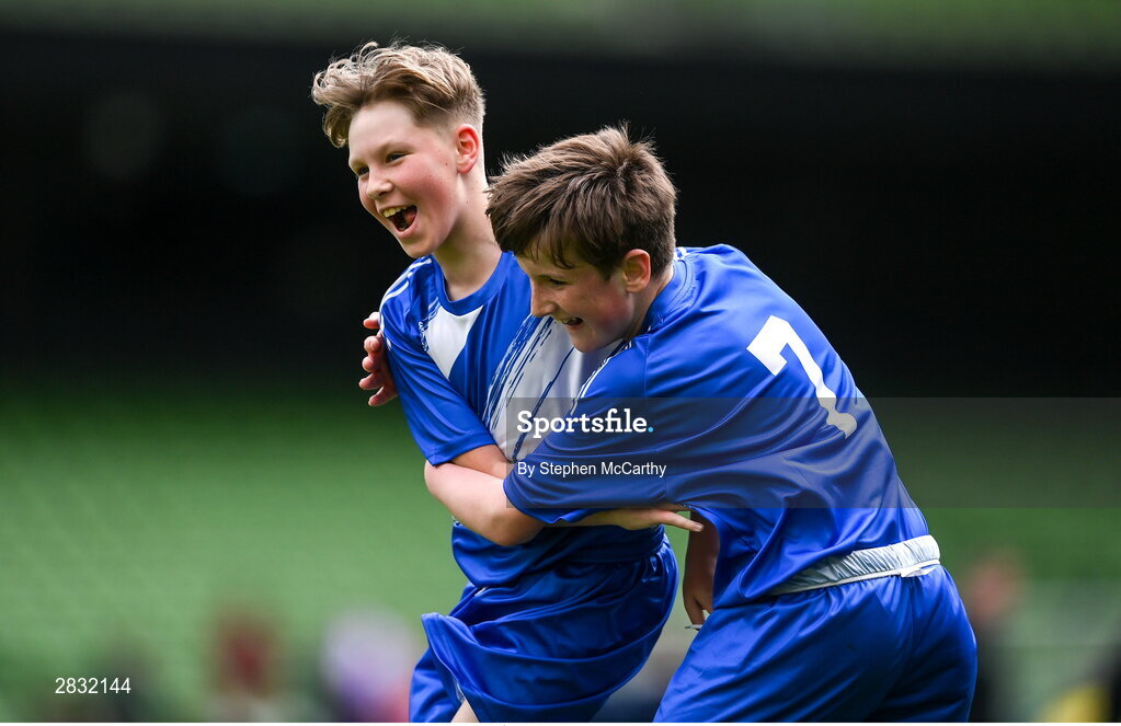 29 May 2024; Lennon O’Brien of Scoil Eoin, Crumlin, Dublin, celebrates with team-mate Killian Flanagan, right, after scoring against Scoil Íosagáin, Buncrana, Inishowen, Donegal, in their Football For All cup match during the FAI Primary 5s Finals day at Aviva Stadium in Dublin. Photo by Stephen McCarthy/Sportsfile