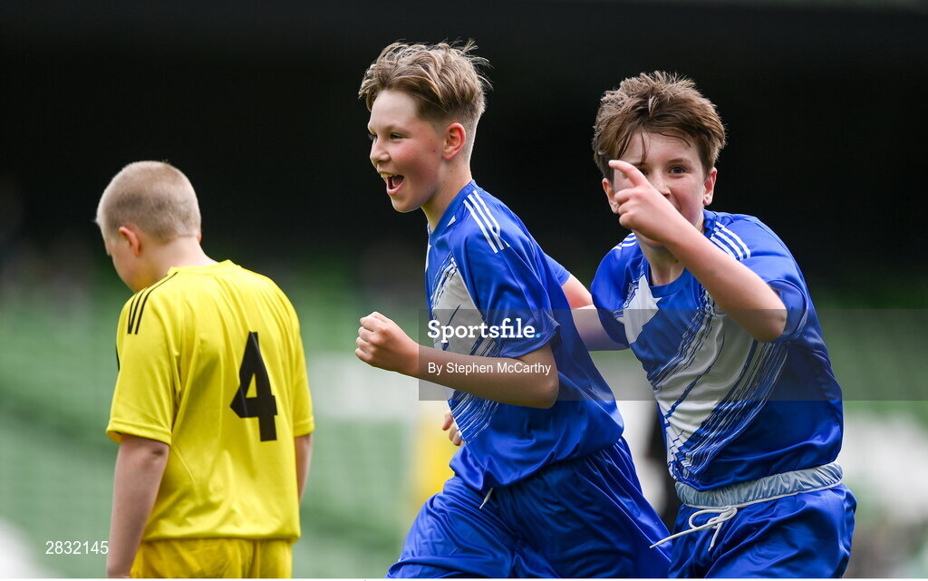29 May 2024; Lennon O’Brien of Scoil Eoin, Crumlin, Dublin, celebrates with team-mate Killian Flanagan, right, after scoring against Scoil Íosagáin, Buncrana, Inishowen, Donegal, in their Football For All cup match during the FAI Primary 5s Finals day at Aviva Stadium in Dublin. Photo by Stephen McCarthy/Sportsfile