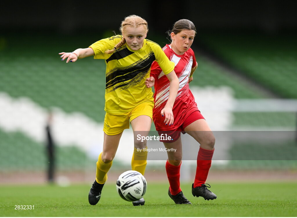 29 May 2024; Andie Forde Peat of Scoil Mhuire, Lacken, Cavan, and Shauna Cullinane of Gurrane NS, Cork, right, during the FAI Primary 5s Finals day at Aviva Stadium in Dublin. Photo by Stephen McCarthy/Sportsfile