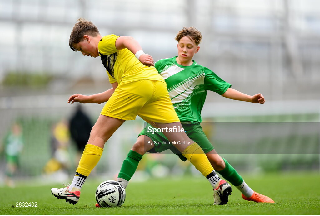 29 May 2024; Rory McGettigan of Illistrin NS, Donegal, in action against Fionn Jennings of St Joseph’s PS, Ballinrobe, Mayo, right, during the FAI Primary 5s Finals day at Aviva Stadium in Dublin. Photo by Stephen McCarthy/Sportsfile