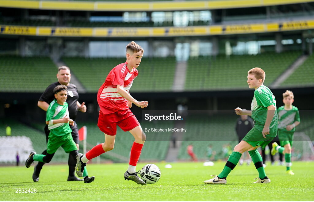 29 May 2024; Tom Ó Caoimh of Gaelscoil Choinn tSáile, Cork, on his way to scoring a goal during the FAI Primary 5s Finals day at Aviva Stadium in Dublin. Photo by Stephen McCarthy/Sportsfile
