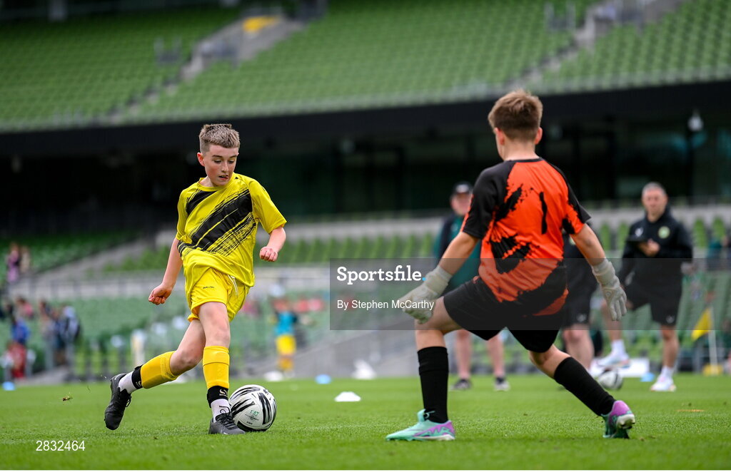 29 May 2024; Jayden Laird of St Eunan’s NS, Raphoe, Donegal, scores past Jay Lynagh of Kentstown NS, Meath, during the FAI Primary 5s Finals day at Aviva Stadium in Dublin. Photo by Stephen McCarthy/Sportsfile