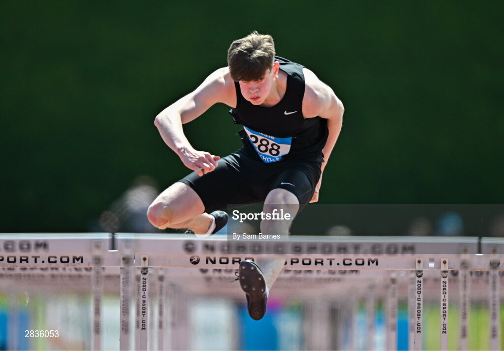 1 June 2024; Seán Owens of Colaiste Éanna, on his way to winning the senior boys 100m hurdles  during day two of the 123.ie All-Ireland Schools’ Track and Field Championships at Tullamore Harriers Athletics Club in Offaly. Photo by Sam Barnes/Sportsfile