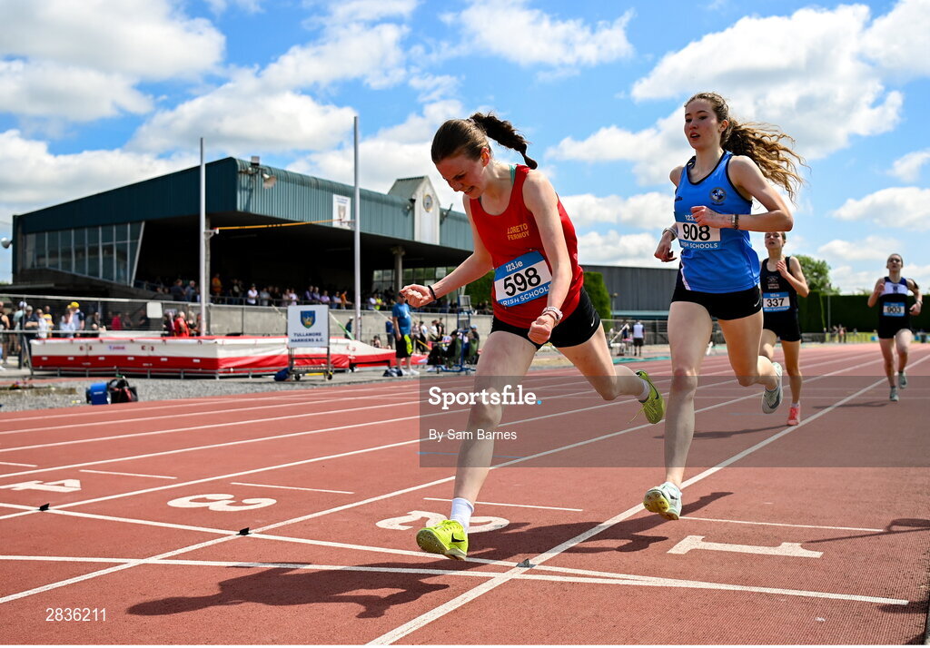 1 June 2024; Rachel O'Flynn of Loreto Fermoy, Cork, celebrates winning the u16 girls mile, ahead of Olivia Morgan of Rathmore Belfast, right, during day two of the 123.ie All-Ireland Schools’ Track and Field Championships at Tullamore Harriers Athletics Club in Offaly. Photo by Sam Barnes/Sportsfile