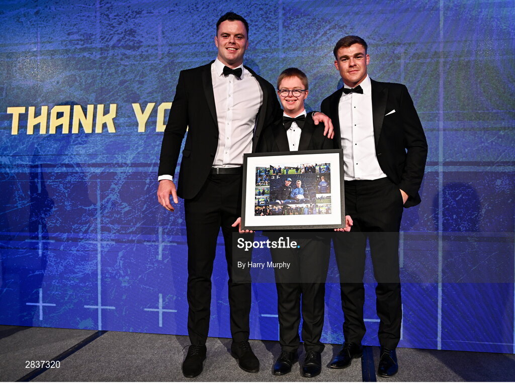 1 June 2024; Leinster Rugby Energia culture captain Andrew McCarthy is presented with a framed picture by Leinster co-captains James Ryan and Garry Ringrose during the 2024 Leinster Rugby Awards Ball at The InterContinental Hotel in Dublin. Photo by Harry Murphy/Sportsfile