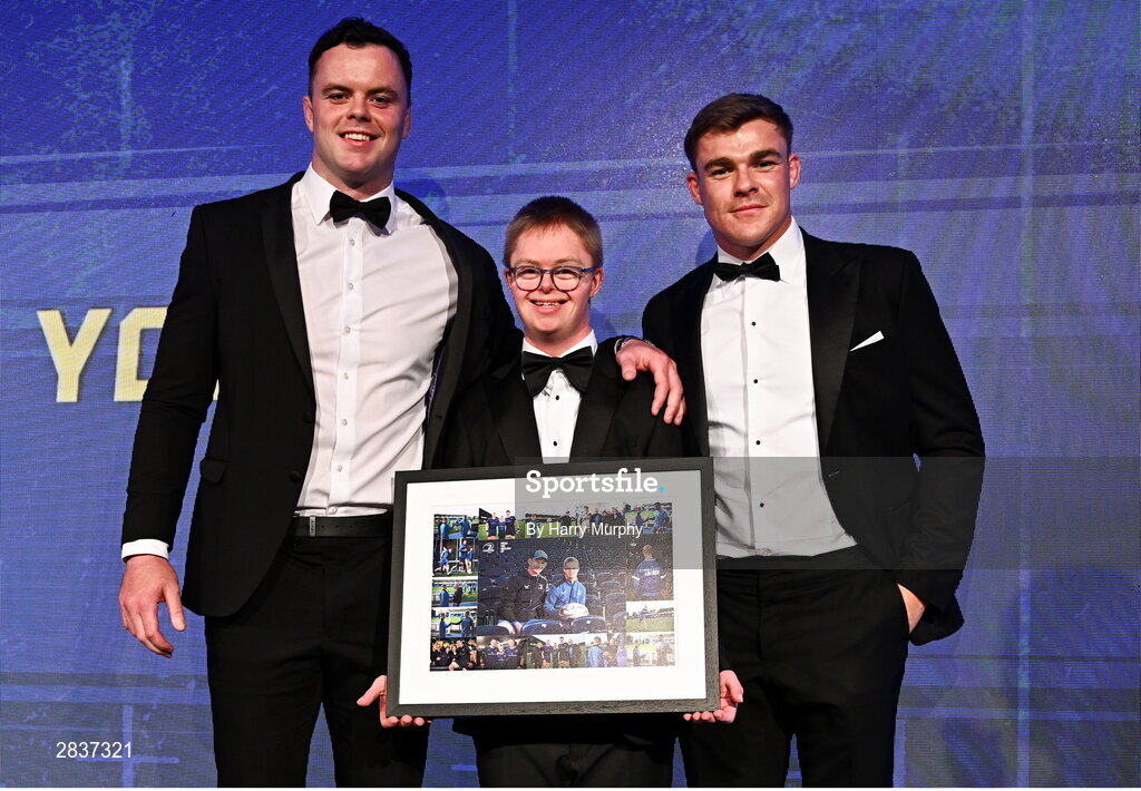 1 June 2024; Leinster Rugby Energia culture captain Andrew McCarthy is presented with a framed picture by Leinster co-captains James Ryan and Garry Ringrose during the 2024 Leinster Rugby Awards Ball at The InterContinental Hotel in Dublin. Photo by Harry Murphy/Sportsfile