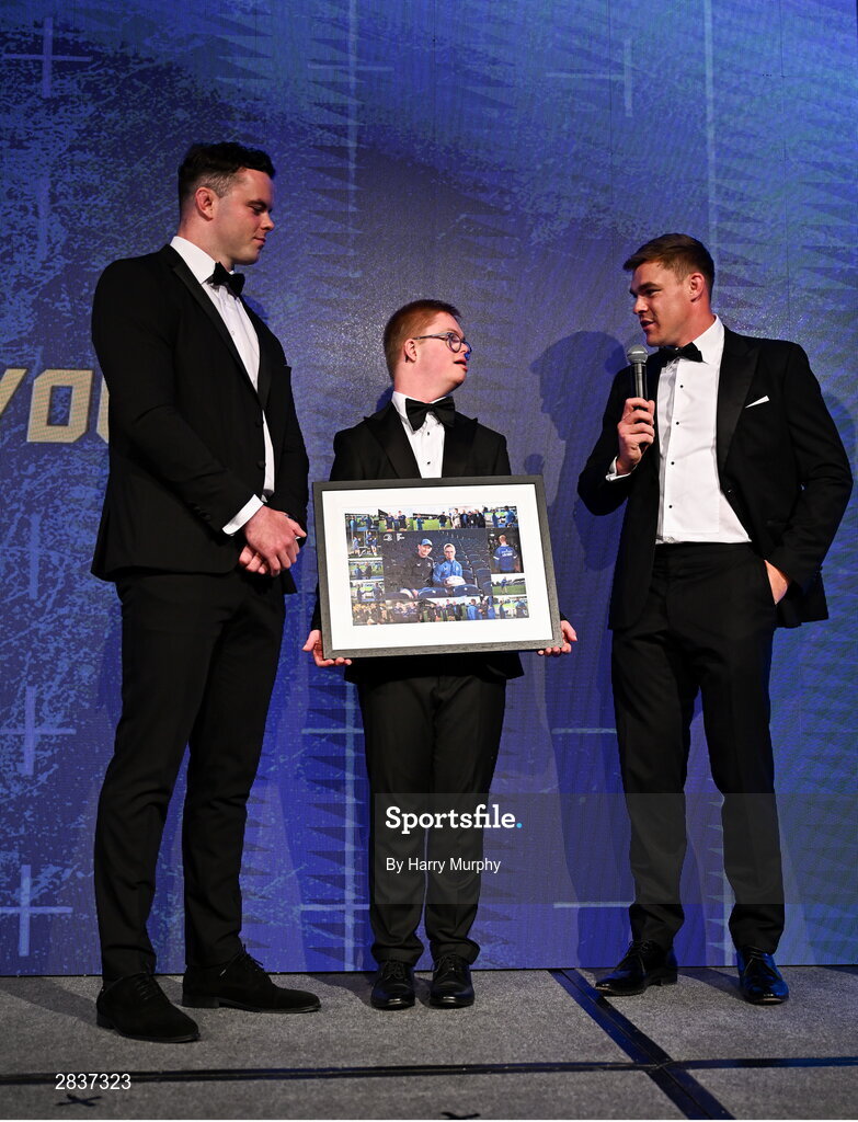 1 June 2024; Leinster Rugby Energia culture captain Andrew McCarthy is presented with a framed picture by Leinster co-captains James Ryan and Garry Ringrose during the 2024 Leinster Rugby Awards Ball at The InterContinental Hotel in Dublin. Photo by Harry Murphy/Sportsfile
