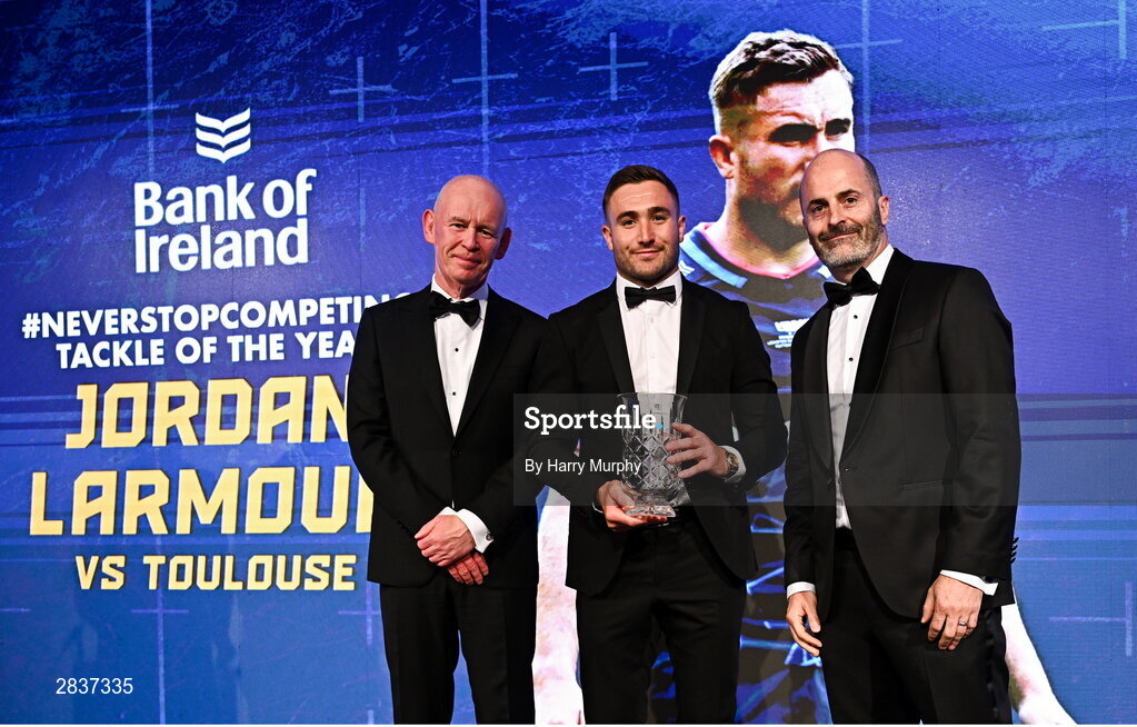 1 June 2024; Jordan Larmour is presented with the Bank of Ireland 'Never Stop Competing' Tackle of the Year award by David Moore of Bank of Ireland and Leinster Rugby president Billy Murphy during the 2024 Leinster Rugby Awards Ball at The InterContinental Hotel in Dublin. Photo by Harry Murphy/Sportsfile