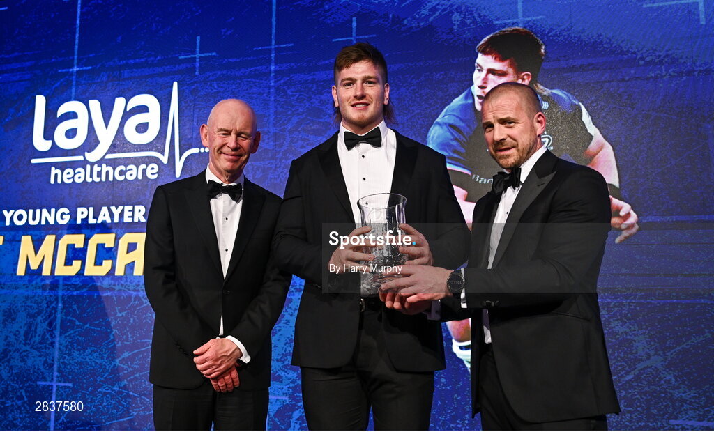 1 June 2024; Joe McCarthy is presented with the Laya Healthcare Men’s Young Player of the Year award by D.O. O’Connor of Laya Healthcare and Leinster Rugby president Billy Murphy during the 2024 Leinster Rugby Awards Ball at The InterContinental Hotel in Dublin. Photo by Harry Murphy/Sportsfile