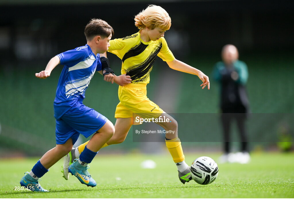 29 May 2024; Lewis Quinn of St Eunan’s NS, Raphoe, Donegal, and Oisín Melia of Kentstown NS, Meath, right, during the FAI Primary 5s Finals day at Aviva Stadium in Dublin. Photo by Stephen McCarthy/Sportsfile