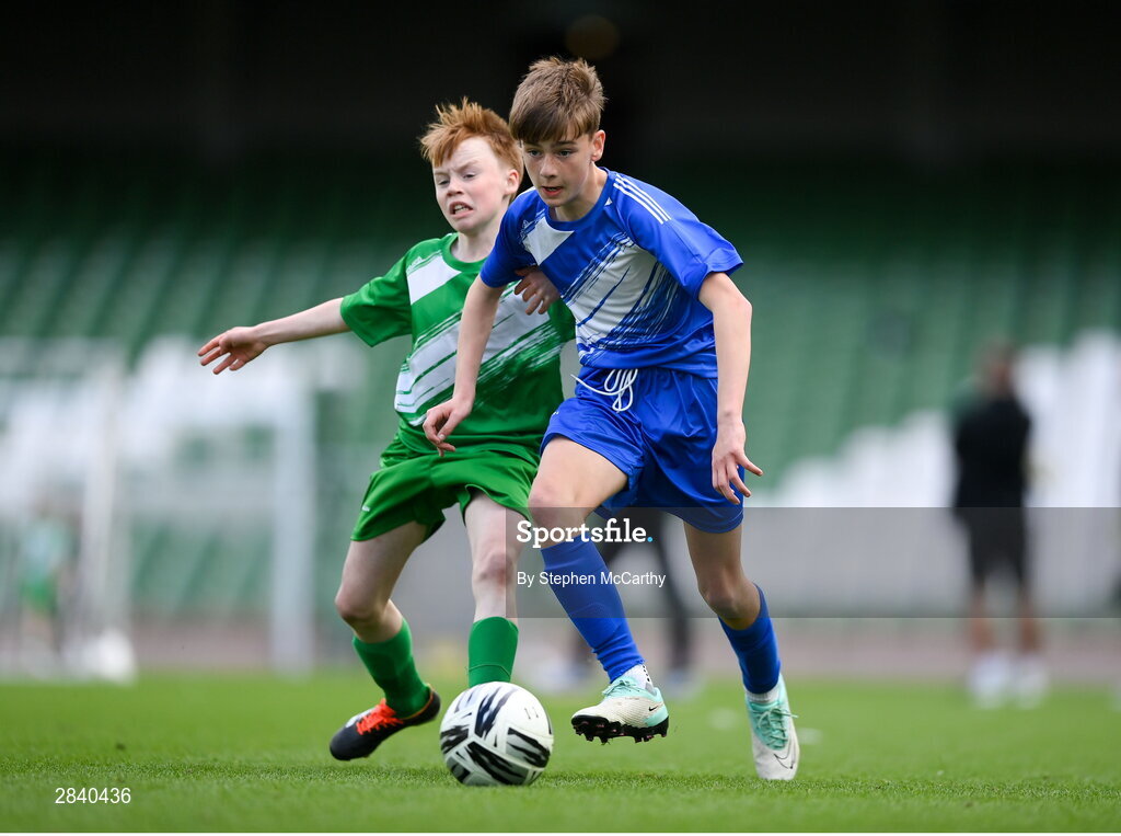 29 May 2024; James Maguire of Scoil Moibhi, Dublin, and Laurence Martyn of Windfield NS, Galway, during the FAI Primary 5s Finals day at Aviva Stadium in Dublin. Photo by Stephen McCarthy/Sportsfile