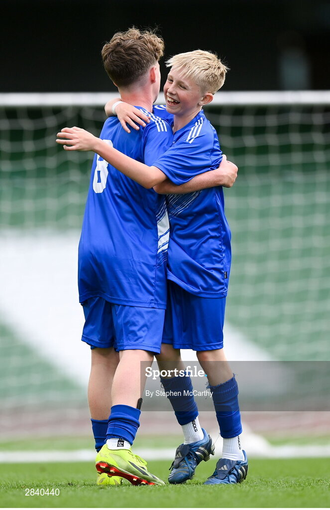 29 May 2024; Eoghan Hosie of Kentstown NS, Meath, celebrates with Mossie Gillic, left, during the FAI Primary 5s Finals day at Aviva Stadium in Dublin. Photo by Stephen McCarthy/Sportsfile