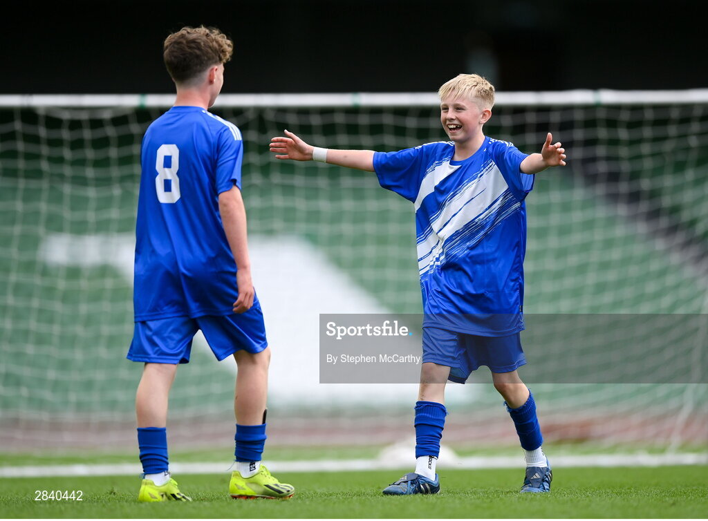 29 May 2024; Eoghan Hosie of Kentstown NS, Meath, celebrates with Mossie Gillic, left, during the FAI Primary 5s Finals day at Aviva Stadium in Dublin. Photo by Stephen McCarthy/Sportsfile