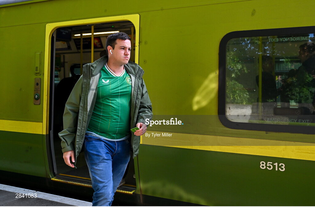 4 June 2024; A Republic of Ireland supporter arrives from the DART before the international friendly match between Republic of Ireland and Hungary at Aviva Stadium in Dublin. Photo by Tyler Miller/Sportsfile