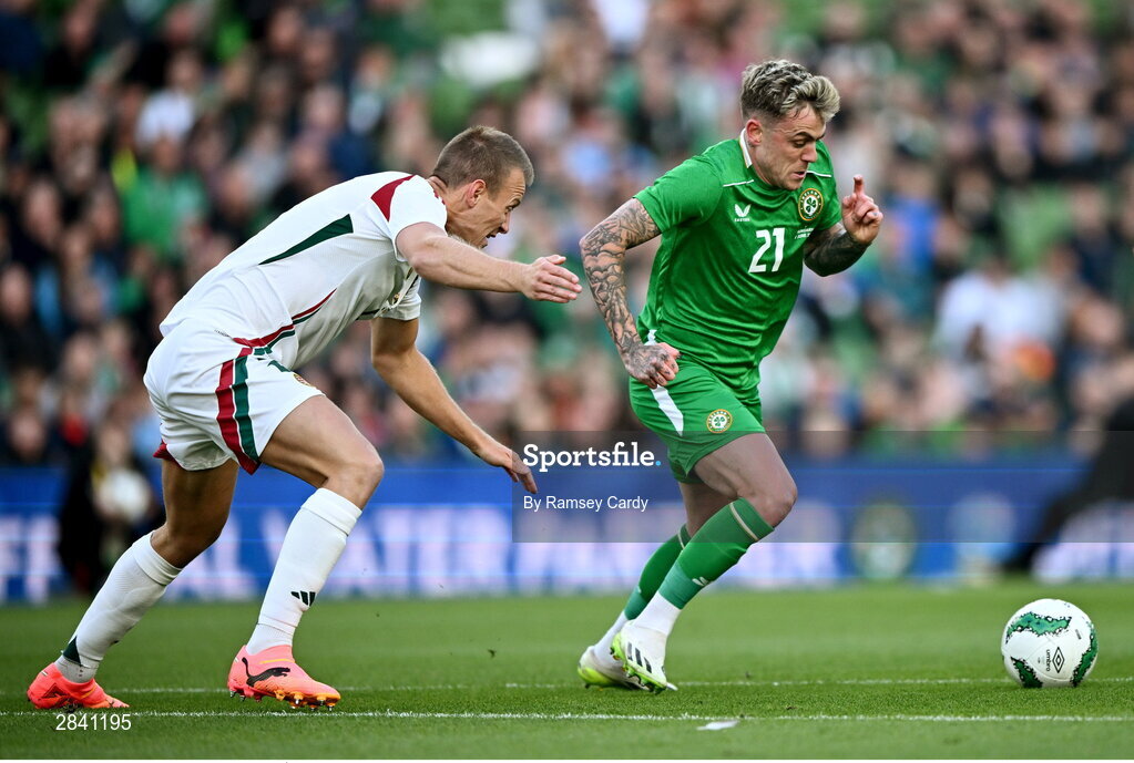 4 June 2024; Sammie Szmodics of Republic of Ireland in action against Ádám Lang of Hungary during the international friendly match between Republic of Ireland and Hungary at Aviva Stadium in Dublin. Photo by Ramsey Cardy/Sportsfile