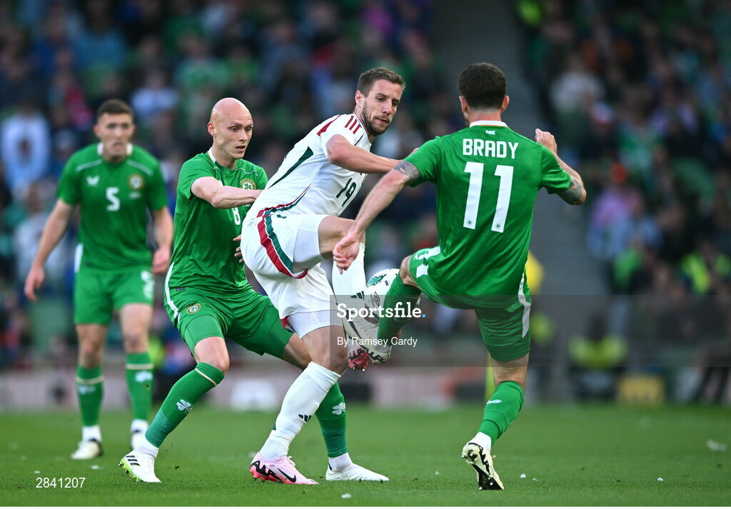 4 June 2024; Barnabás Varga of Hungary in action against Will Smallbone and Robbie Brady of Republic of Ireland during the international friendly match between Republic of Ireland and Hungary at Aviva Stadium in Dublin. Photo by Ramsey Cardy/Sportsfile