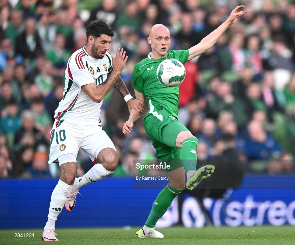 4 June 2024; Will Smallbone of Republic of Ireland in action against Dominik Szoboszlai of Hungary during the international friendly match between Republic of Ireland and Hungary at Aviva Stadium in Dublin. Photo by Ramsey Cardy/Sportsfile