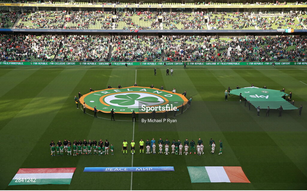 4 June 2024; The Republic of Ireland and Hungary teams stand for the playing of the national anthems before the international friendly match between Republic of Ireland and Hungary at Aviva Stadium in Dublin. Photo by Michael P Ryan/Sportsfile