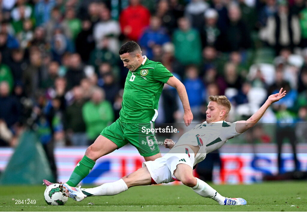 4 June 2024; Josh Cullen of Republic of Ireland is tackled by András Schäfer of Hungary during the international friendly match between Republic of Ireland and Hungary at Aviva Stadium in Dublin. Photo by Ramsey Cardy/Sportsfile