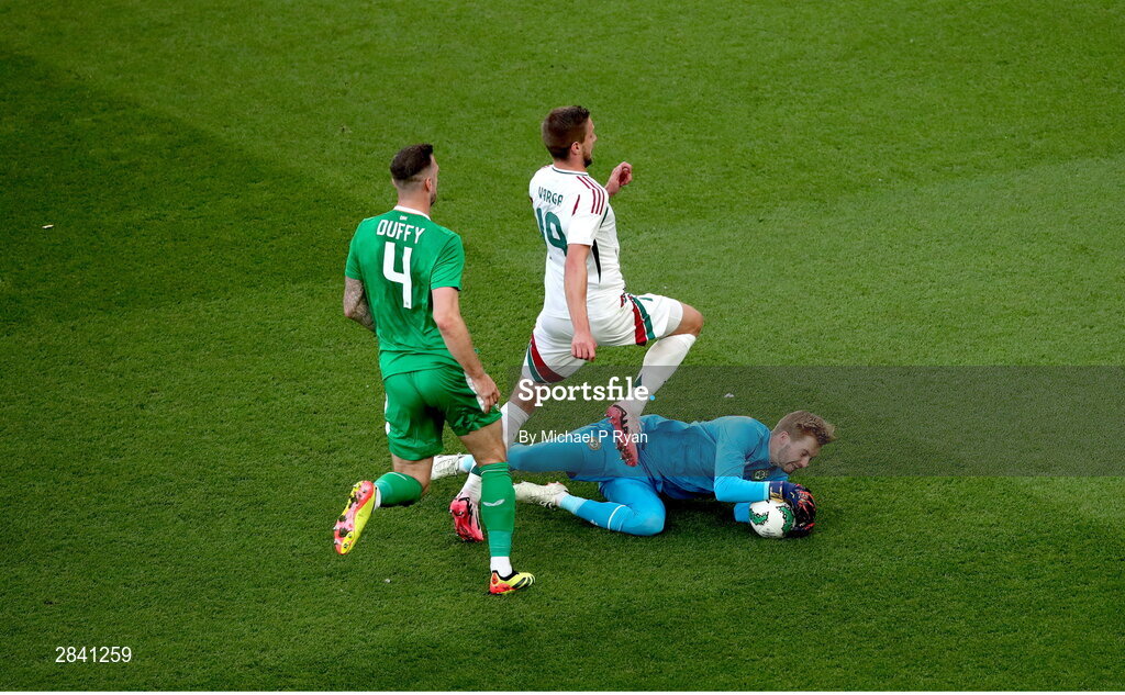4 June 2024; Barnabás Varga of Hungary has a shot on goal blocked by Republic of Ireland goalkeeper Caoimhin Kelleher during the international friendly match between Republic of Ireland and Hungary at Aviva Stadium in Dublin. Photo by Michael P Ryan/Sportsfile