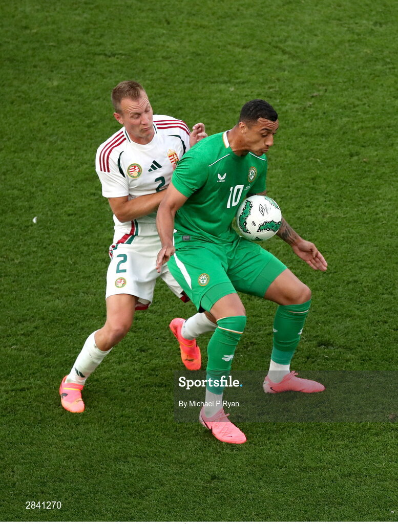 4 June 2024; Adam Idah of Republic of Ireland in action against Ádám Lang of Hungary during the international friendly match between Republic of Ireland and Hungary at Aviva Stadium in Dublin. Photo by Michael P Ryan/Sportsfile