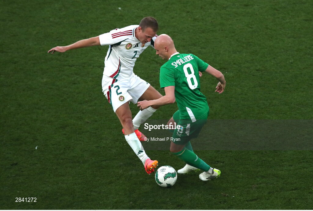 4 June 2024; Will Smallbone of Republic of Ireland in action against Ádám Lang of Hungary during the international friendly match between Republic of Ireland and Hungary at Aviva Stadium in Dublin. Photo by Michael P Ryan/Sportsfile