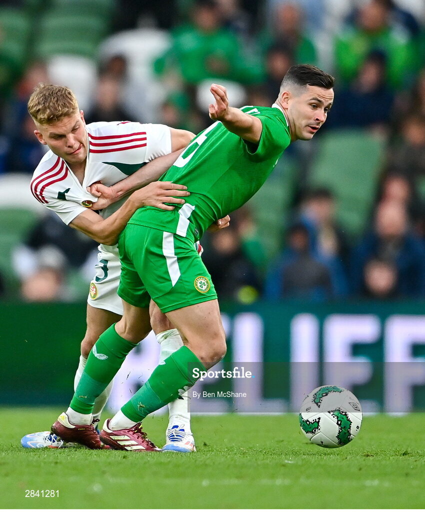 4 June 2024; Josh Cullen of Republic of Ireland in action against András Schäfer of Hungary during the international friendly match between Republic of Ireland and Hungary at Aviva Stadium in Dublin. Photo by Ben McShane/Sportsfile
