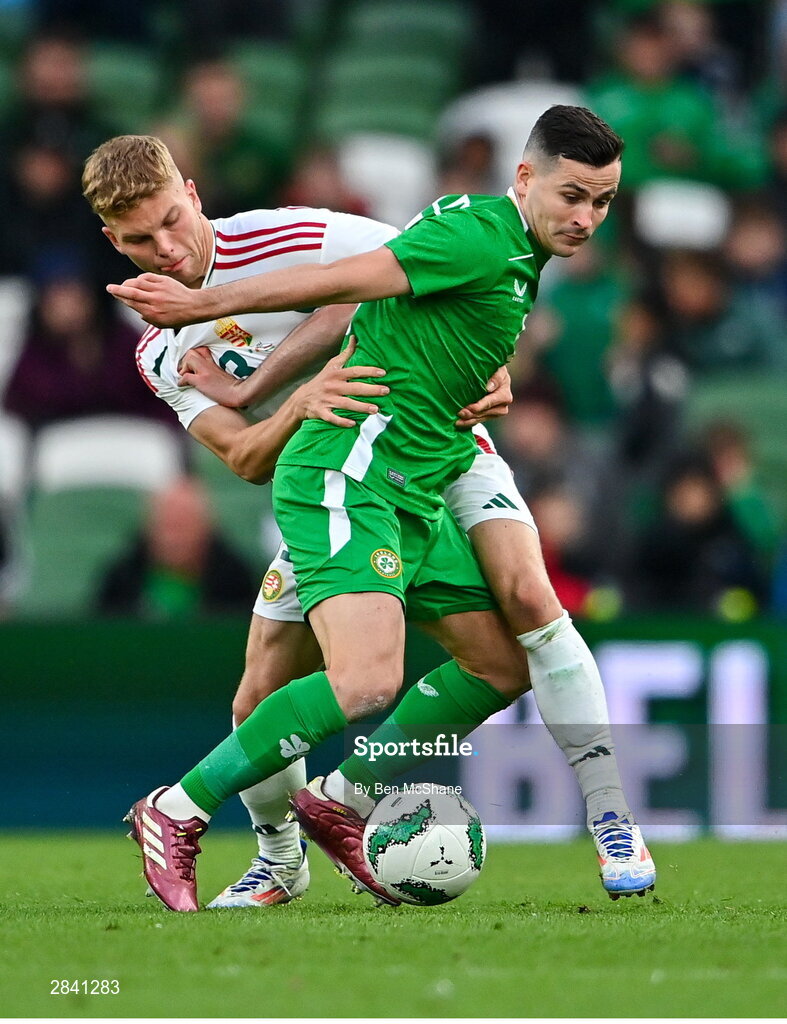 4 June 2024; Josh Cullen of Republic of Ireland in action against András Schäfer of Hungary during the international friendly match between Republic of Ireland and Hungary at Aviva Stadium in Dublin. Photo by Ben McShane/Sportsfile