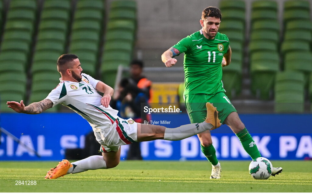 4 June 2024; Robbie Brady of Republic of Ireland is tackled by Endre Botka of Hungary during the international friendly match between Republic of Ireland and Hungary at Aviva Stadium in Dublin. Photo by Tyler Miller/Sportsfile