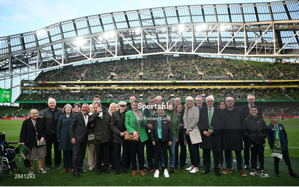 4 June 2024; Members of the families of the Republic of Ireland team that played in the 1924 Olympic Games, the first men's international fixtures, on the pitch at half-time of the international friendly match between Republic of Ireland and Hungary at Aviva Stadium in Dublin. Photo by Ramsey Cardy/Sportsfile