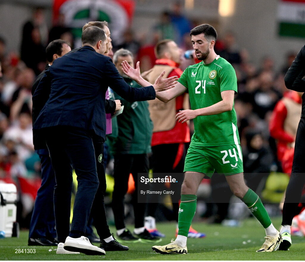 4 June 2024; Finn Azaz of Republic of Ireland shakes hands with Republic of Ireland interim head coach John O'Shea after being replaced during the international friendly match between Republic of Ireland and Hungary at Aviva Stadium in Dublin. Photo by Ramsey Cardy/Sportsfile