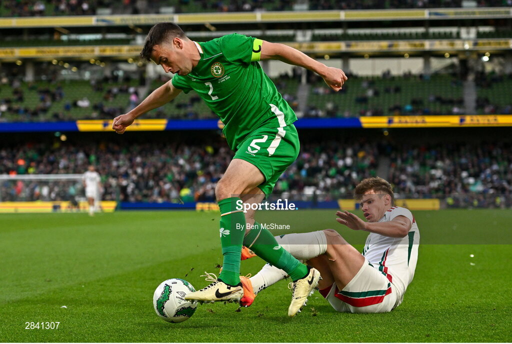 4 June 2024; Seamus Coleman of Republic of Ireland is tackled by Milos Kerkez of Hungary during the international friendly match between Republic of Ireland and Hungary at Aviva Stadium in Dublin. Photo by Ben McShane/Sportsfile