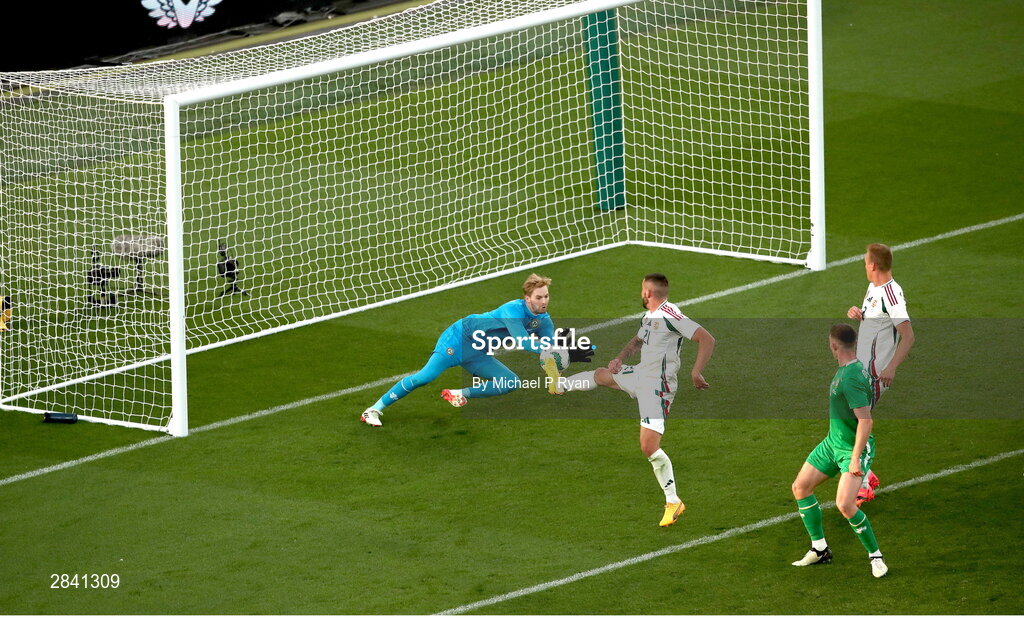 4 June 2024; Márton Dárdai of Hungary has a shot on goal blocked by Republic of Ireland goalkeeper Caoimhin Kelleher during the international friendly match between Republic of Ireland and Hungary at Aviva Stadium in Dublin. Photo by Michael P Ryan/Sportsfile