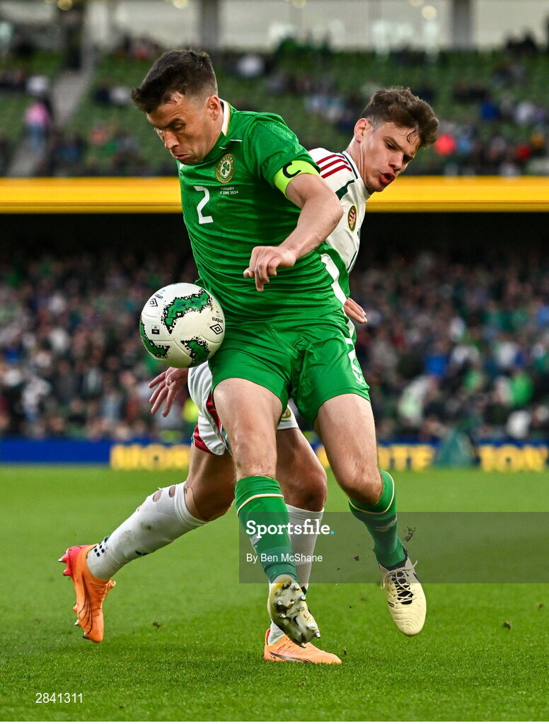 4 June 2024; Seamus Coleman of Republic of Ireland is tackled by Milos Kerkez of Hungary during the international friendly match between Republic of Ireland and Hungary at Aviva Stadium in Dublin. Photo by Ben McShane/Sportsfile