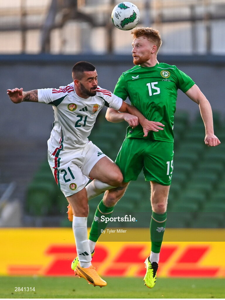 4 June 2024; Liam Scales of Republic of Ireland in action against Endre Botka of Hungary during the international friendly match between Republic of Ireland and Hungary at Aviva Stadium in Dublin. Photo by Tyler Miller/Sportsfile