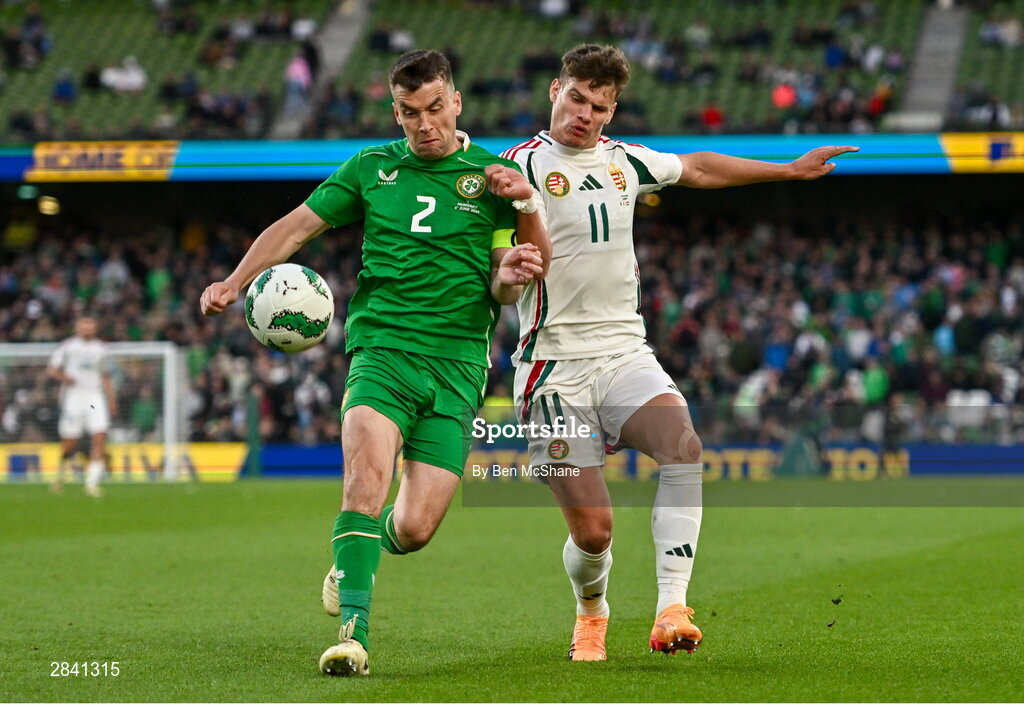 4 June 2024; Seamus Coleman of Republic of Ireland is tackled by Milos Kerkez of Hungary during the international friendly match between Republic of Ireland and Hungary at Aviva Stadium in Dublin. Photo by Ben McShane/Sportsfile