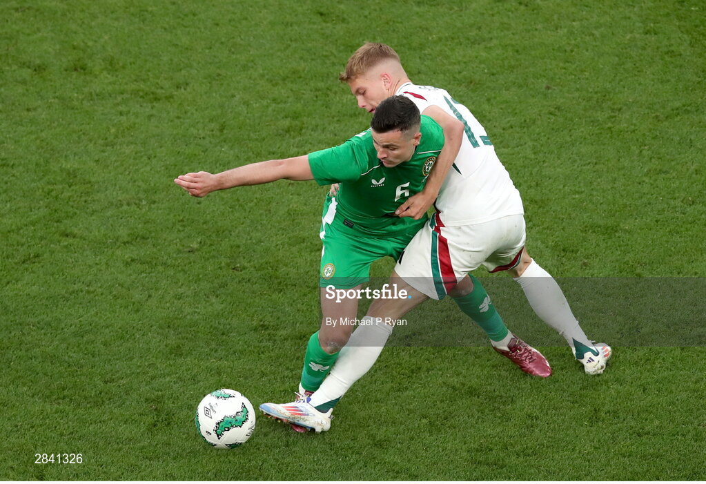 4 June 2024; Josh Cullen of Republic of Ireland in action against András Schäfer of Hungary during the international friendly match between Republic of Ireland and Hungary at Aviva Stadium in Dublin. Photo by Michael P Ryan/Sportsfile
