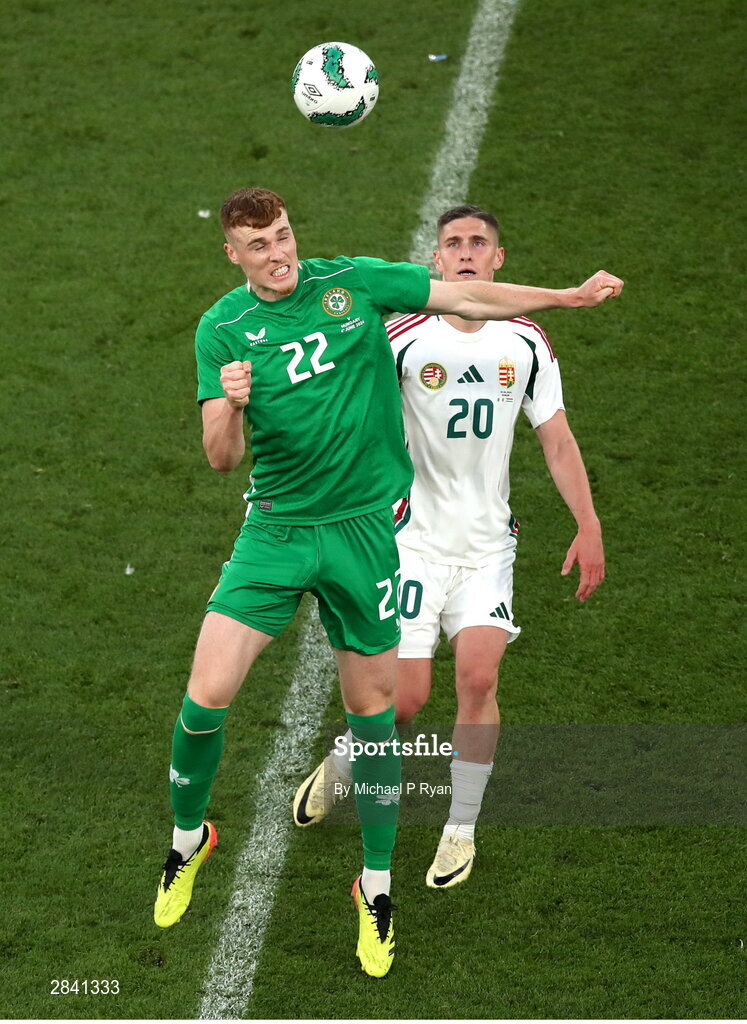 4 June 2024; Jake O'Brien of Republic of Ireland in action against Roland Sallai of Hungary during the international friendly match between Republic of Ireland and Hungary at Aviva Stadium in Dublin. Photo by Michael P Ryan/Sportsfile
